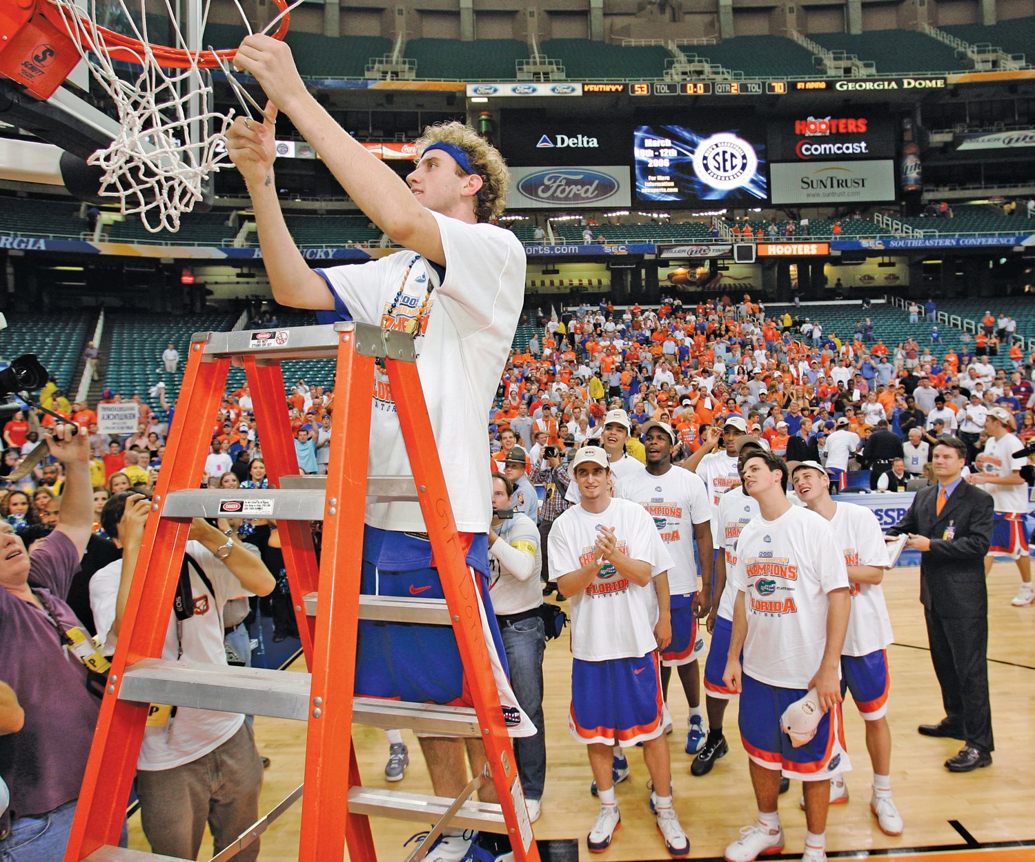 Holland’s Matt Walsh cuts down the net following Florida’s first SEC Tournament Championship in 2005. Walsh was named tournament MVP.