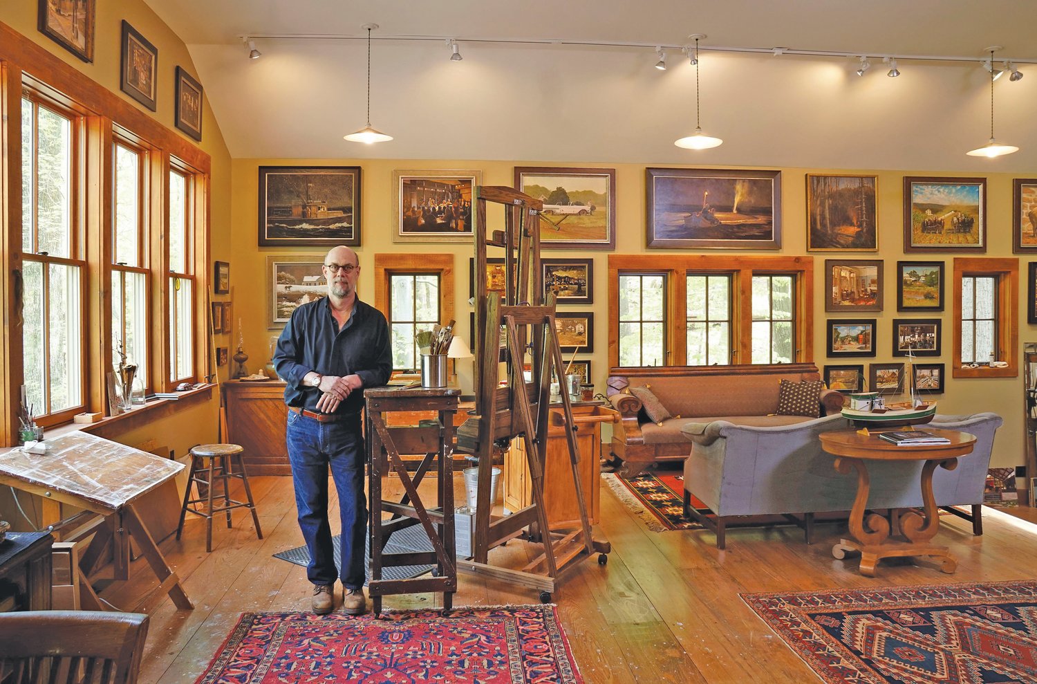 Robert Beck, with his paintbrushes and easel at the ready.