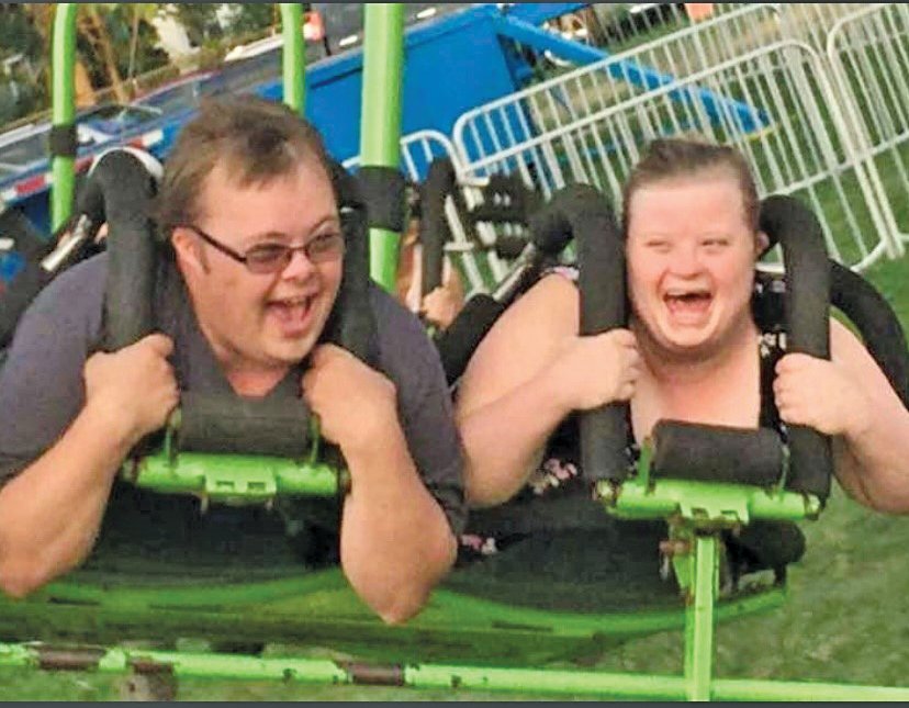 Tessa Maychuk, 28, and Justin Bryan, 30, have fun on one of the amusement rides.