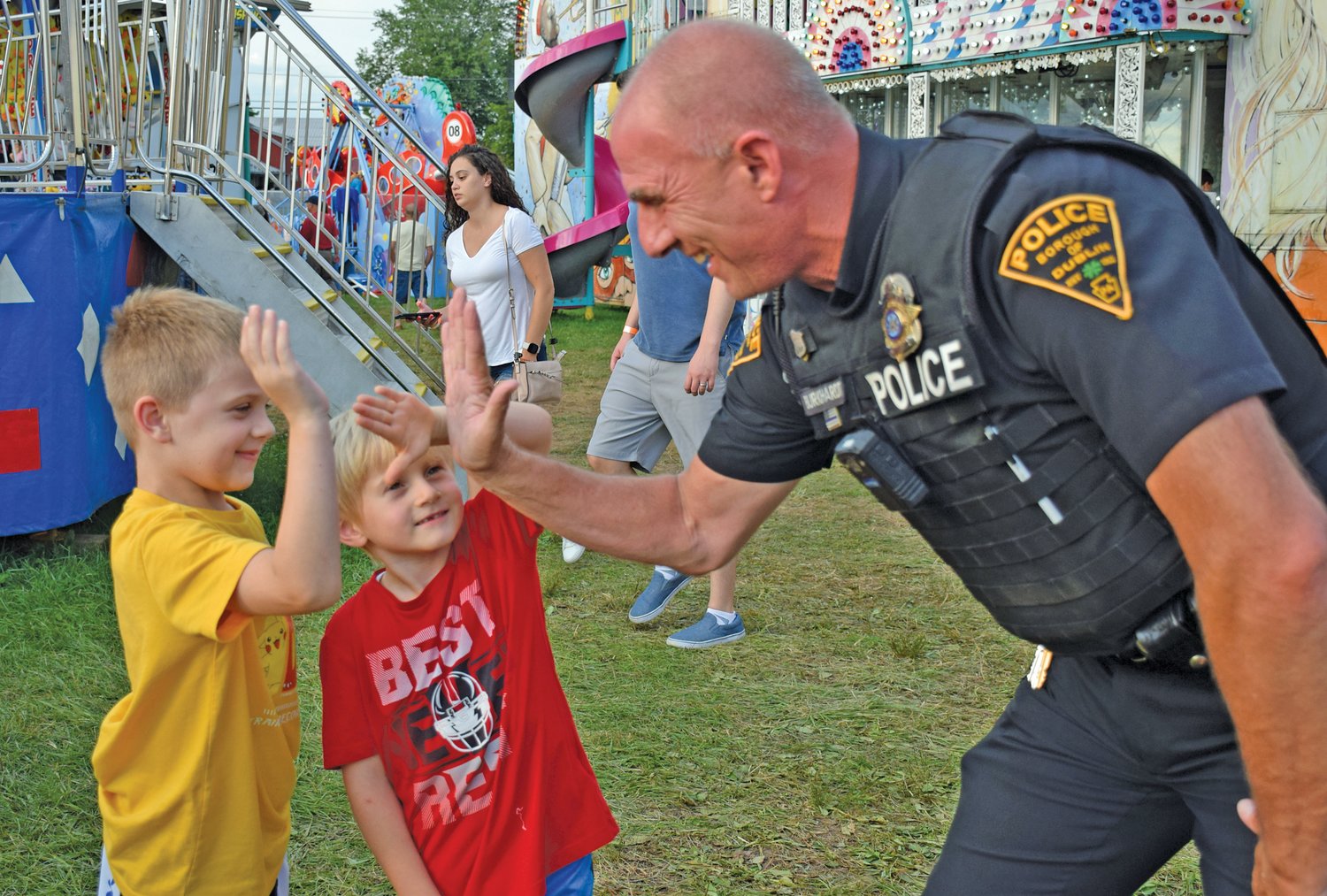Cooper Mead and Cooper Smith with Officer Rob Burkhardt of the Dublin Borough Police Department.