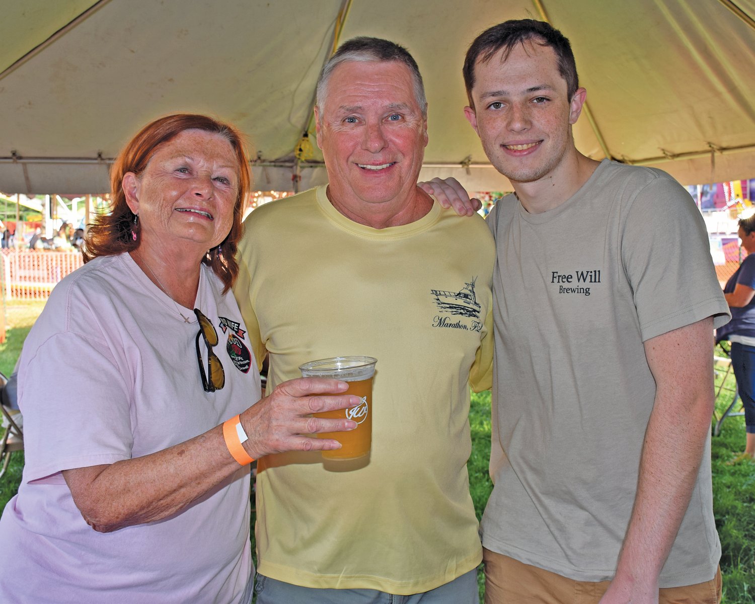 John and Sharon Corbett of Perkasie in the beer garden with Trevor Fling of Free Will Brewing Co.