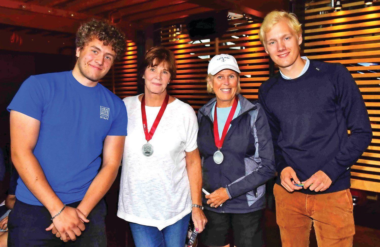 Second-place winners Darlette Jenkins and Sue Hart with Rally Masters Josh Eisen and Trey Dusek.