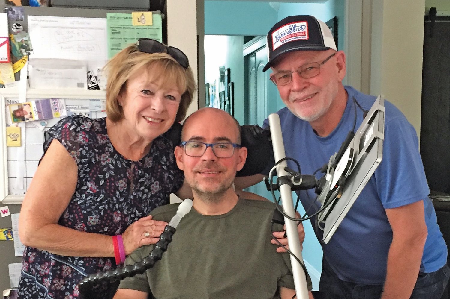 Central Bucks residents Barbara and Gene Smith with their son, Jay, who is living with ALS. Jay’s family are organizing a fundraiser, DanceForJay#endALS, which is set to take place in January. Supporters can participate virtually or in person. To register, visit bidpal.net/danceforjay. Proceeds will support Jay’s Medical Trust.