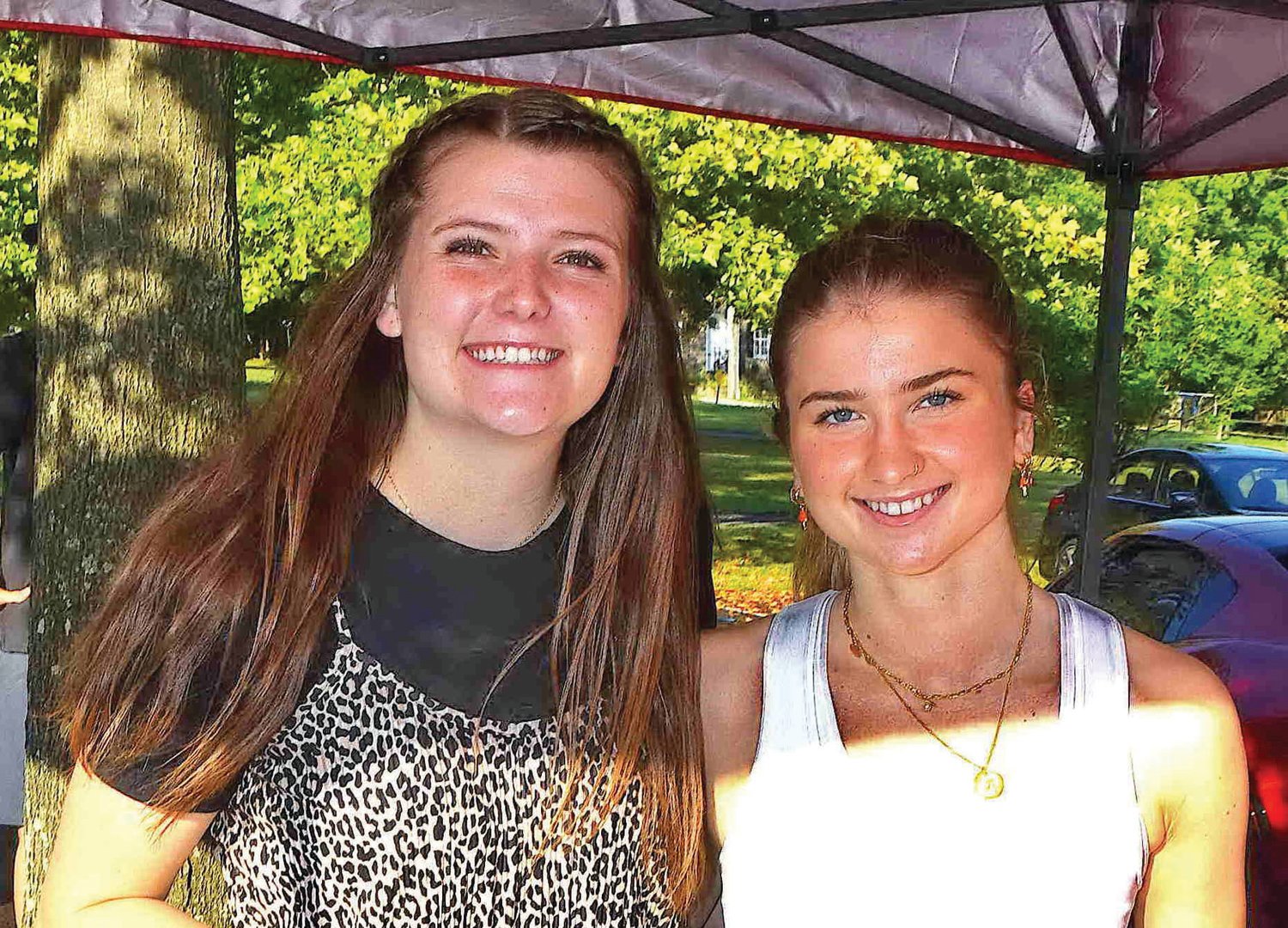 Volunteers Camille Richards and Annelise Dahlin serve coffee and goodies.