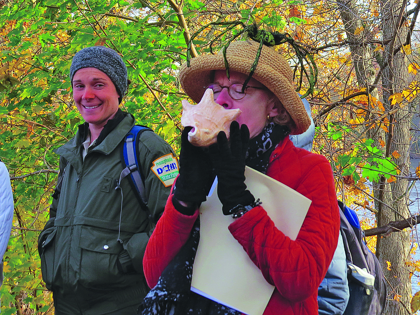 Carole Mebus photographed Susan Taylor on October 31, 2015. Susan always “blew” the conch shell at the beginning of an October Canal Walk, this one on Halloween. The second person in the photo is Katie Martens, Delaware Canal State Park Educator.