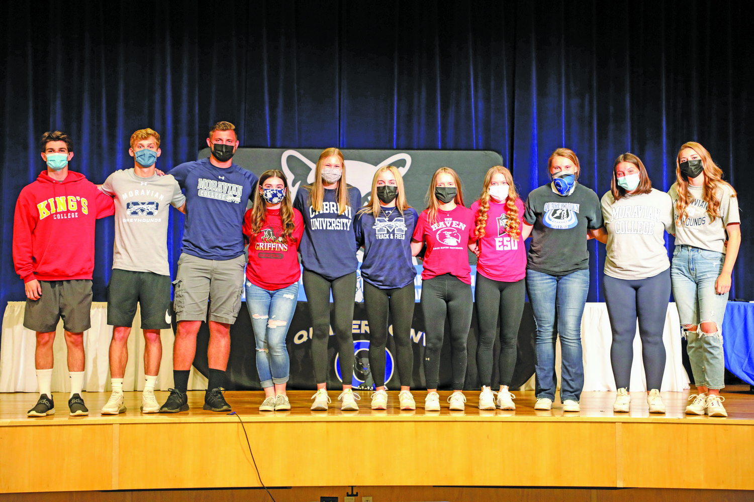 Members of Quakertown’s Class of 2021 were recognized earlier this year for their commitment to play collegiate sports. From left are: Zach Webb, Trevor Gray, Matt Pavone, Fallon Grandinetti, Holly Smith, Rylie Murphy, Paige Daugherty, Kayla Horning, Kerrin Long, Liz Miskovsky and Abigail McClaskey. Not pictured are: Glenn Moyer and Andrew Saglimbeni.