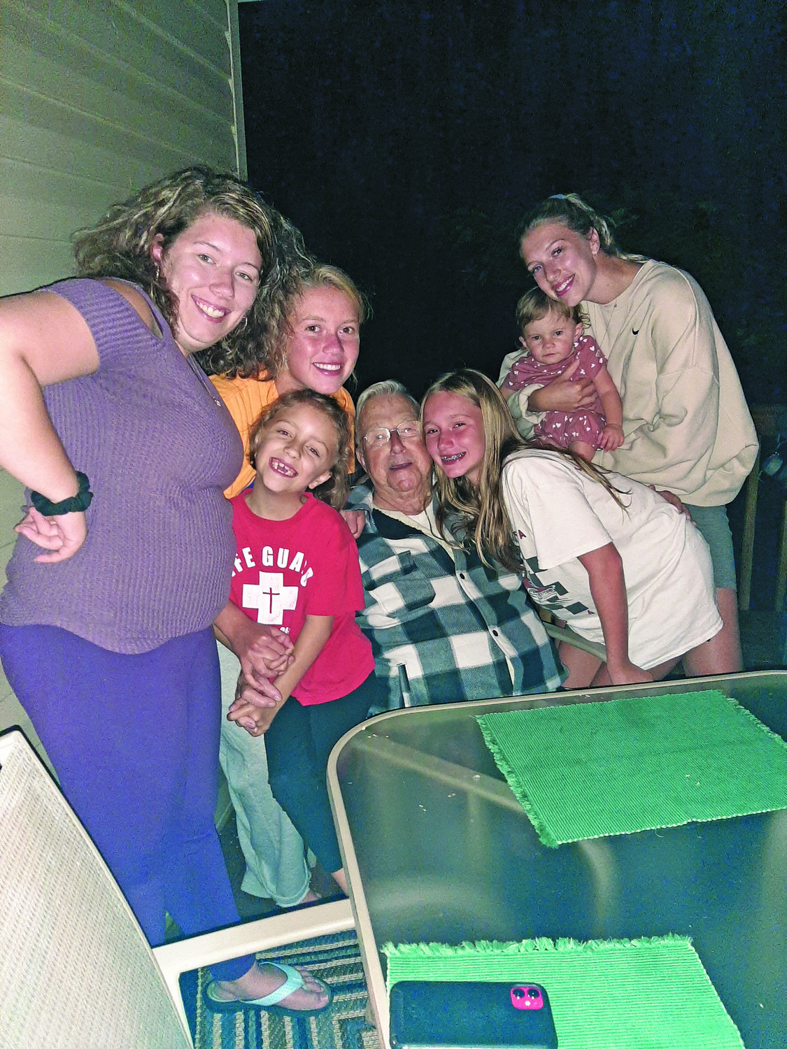 Ed Luecke with his granddaughters and great-granddaughters. From top left are Emily, Danae, Lilly, and Alyssa. From bottom left are Madison, Ed and Megan.