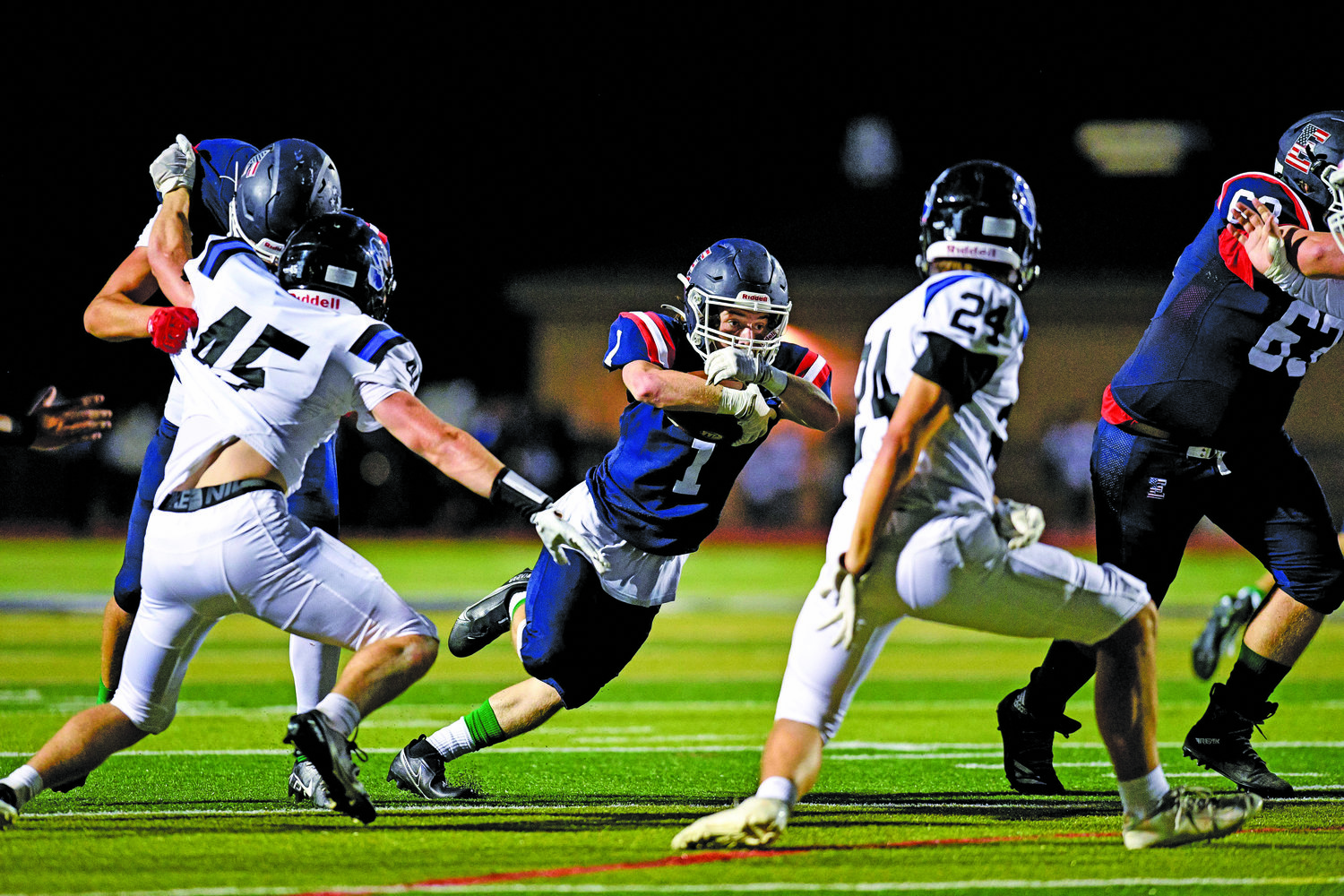 CB East’s Declan Kelly slashes through the hole, gaining a first down.
