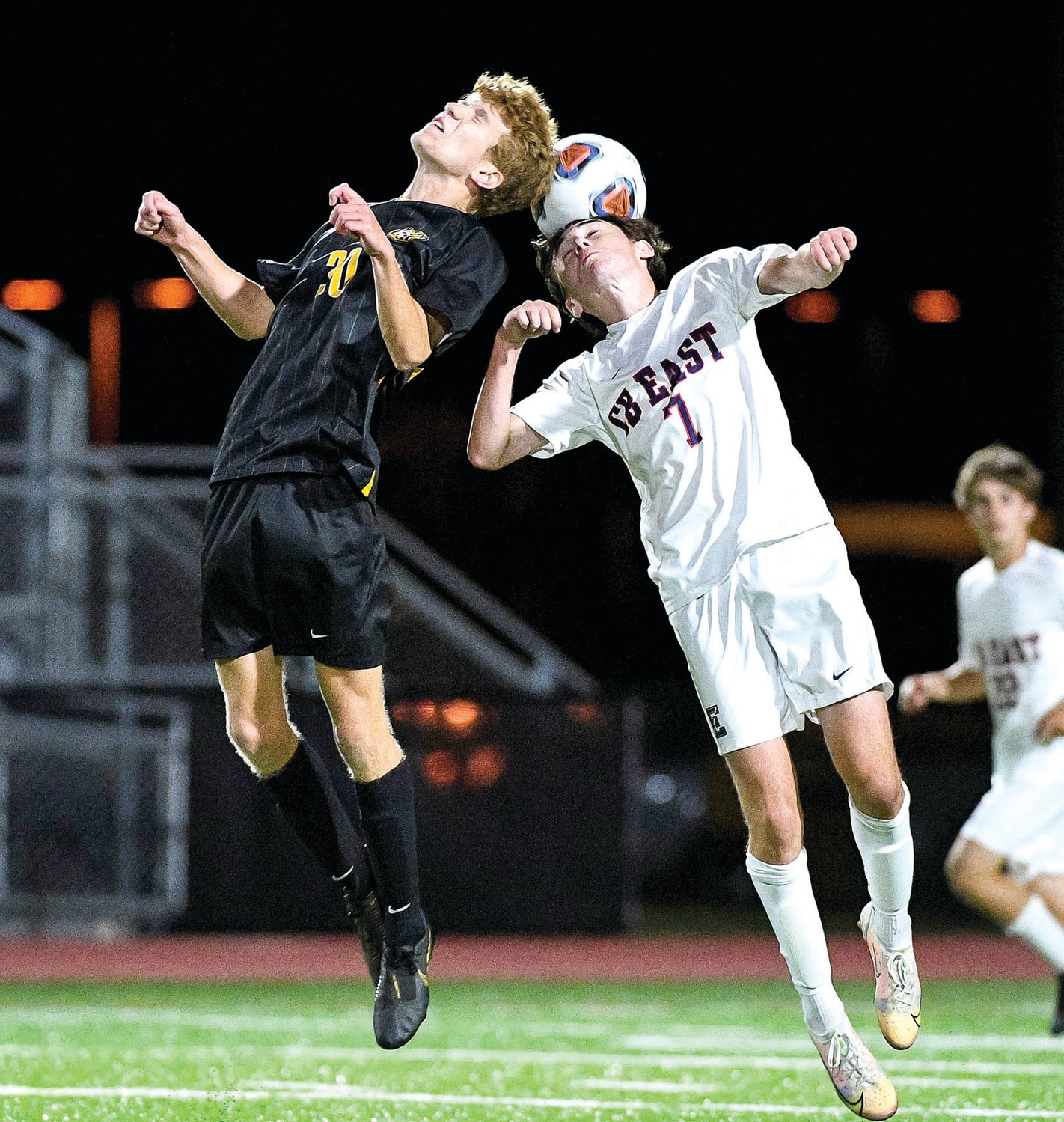 CB West’s Kyle Flaherty and CB East’s Cole Hedden go up for a header.