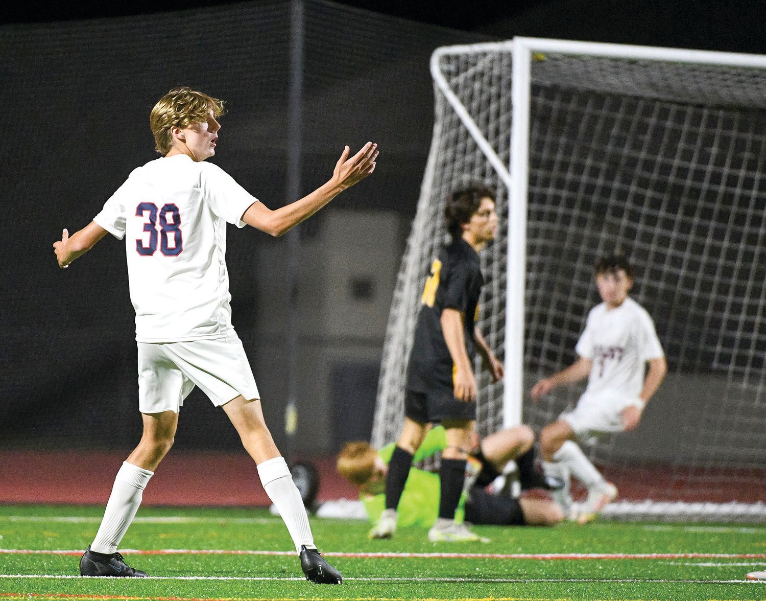 CB East’s Toby Senior can’t believe the ball went into the net after CB West scored on its own goal.