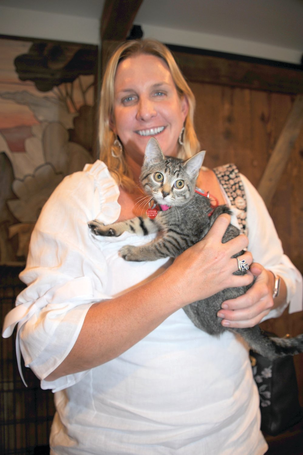 Christine Gale holds a newly adopted kitty ... not hers.
