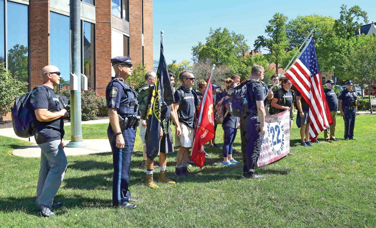 The 22 marchers line up on the Memorial Courtyard.
