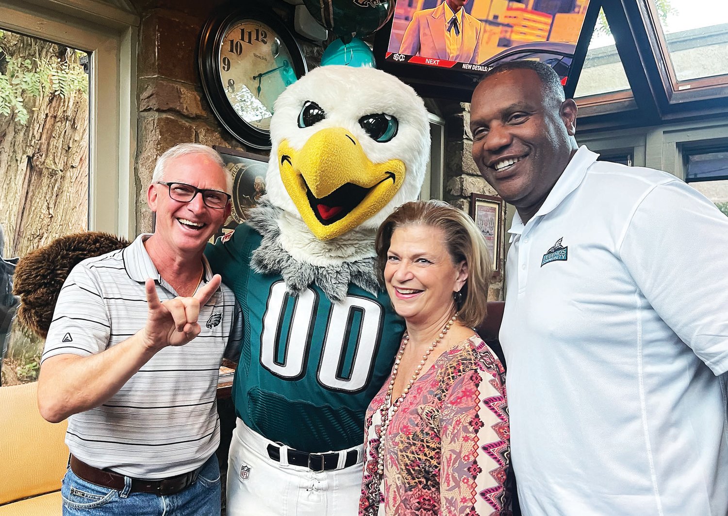 Longtime Pickering Manor supporter Greg Downs, Swoop, CEO Michelle Knobloch and Eagles alumnus William Thomas.