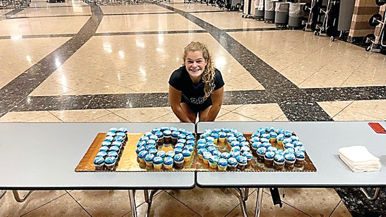 CB South girls volleyball senior captain Millie Grove celebrates reaching 1,000 kills in her career with cupcakes.