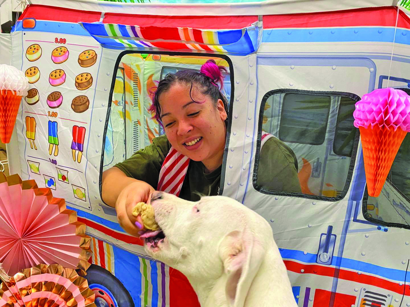 A dog gets a sweet treat at the Doggies Ice Cream Social.