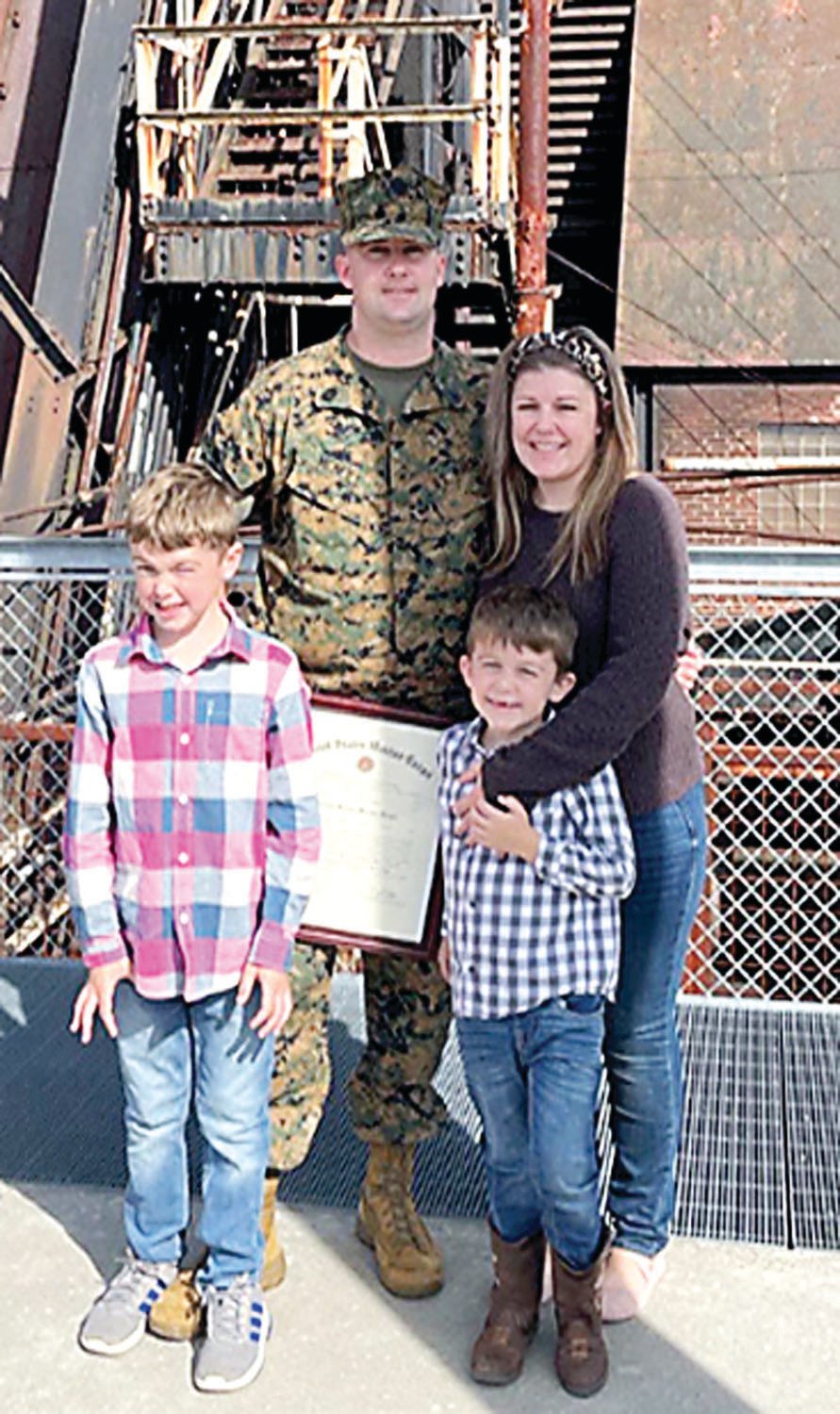 Gunnery Sgt. Cameron McNeill and his family.