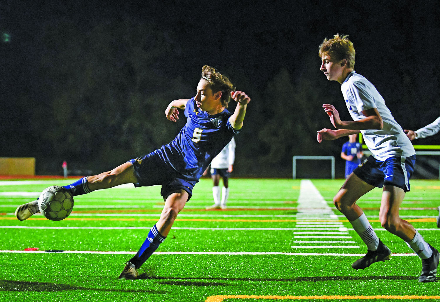 New Hope’s Logan Moore directs a shot toward the goal in front of Cheltenham’s Coleman Funk.