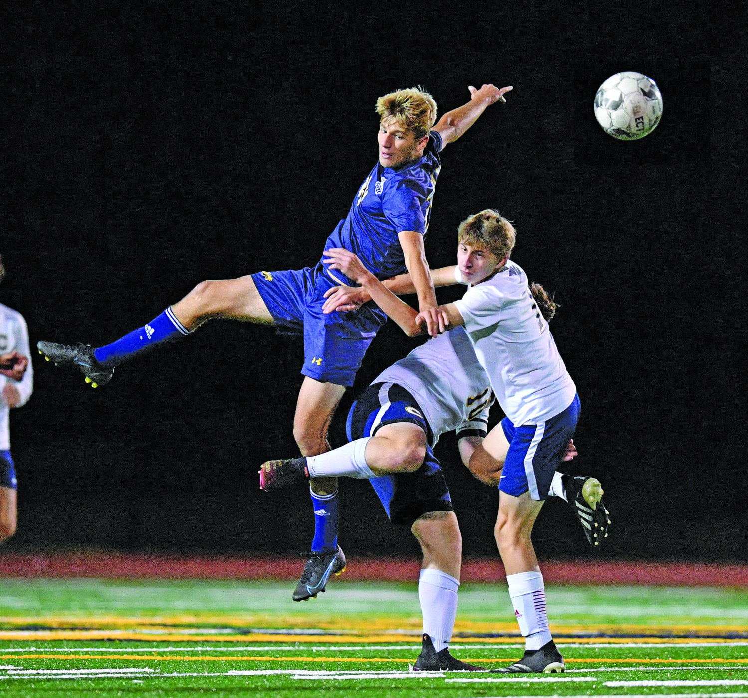 New Hope’s Jake Hausner beats a double team of Cheltenham’s Coleman Funk, front, and Paolo Musumeci.