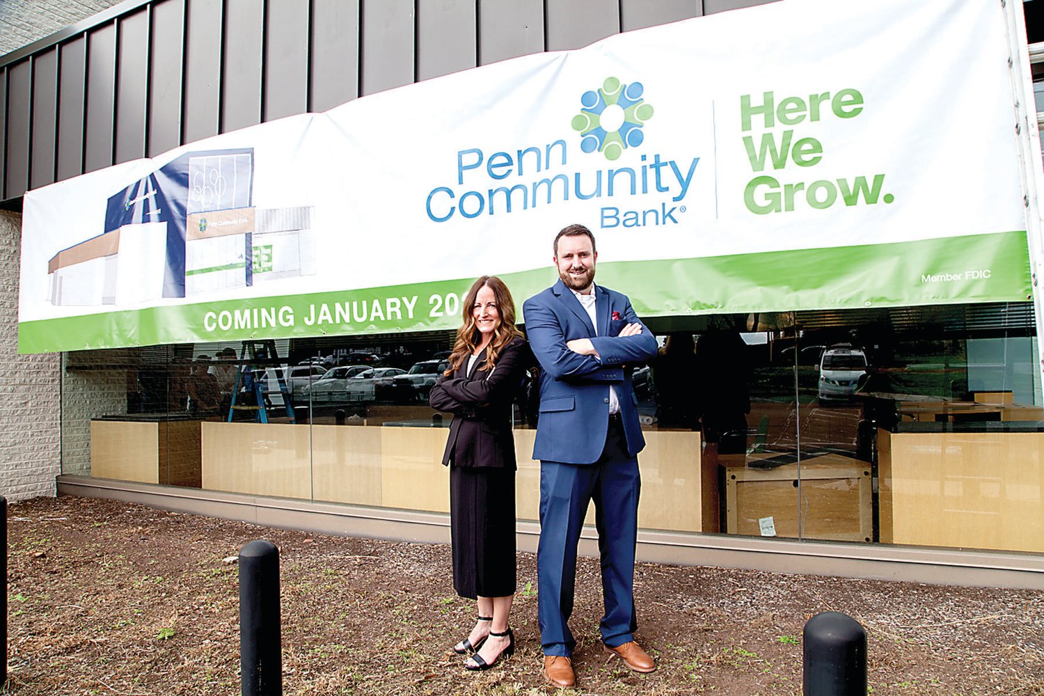 Branch Manager Melanie Scholl and Sales and Service Manager Christopher Stein pose in front of the new Penn Community Bank location coming to Lansdale in 2022.