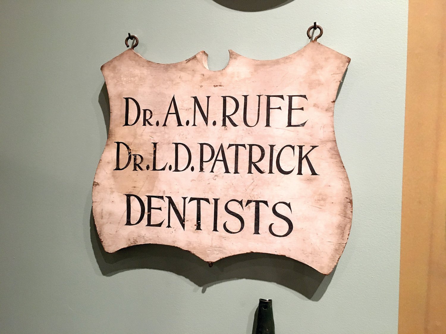 A dentist’s sign hangs inside the Mercer Museum’s exhibit on Bucks County history.