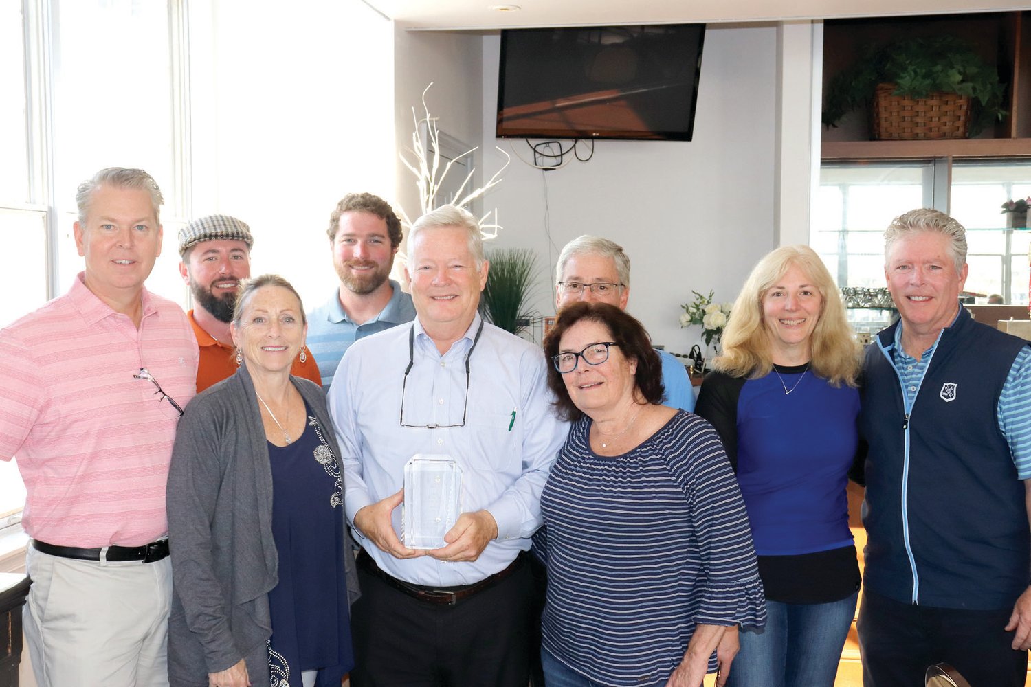 Leo Quinn, center, surrounded by his family, was recently presented with the 2020 Lois Burpee Service award for his dedicated service to the YMCA 
of Bucks County.