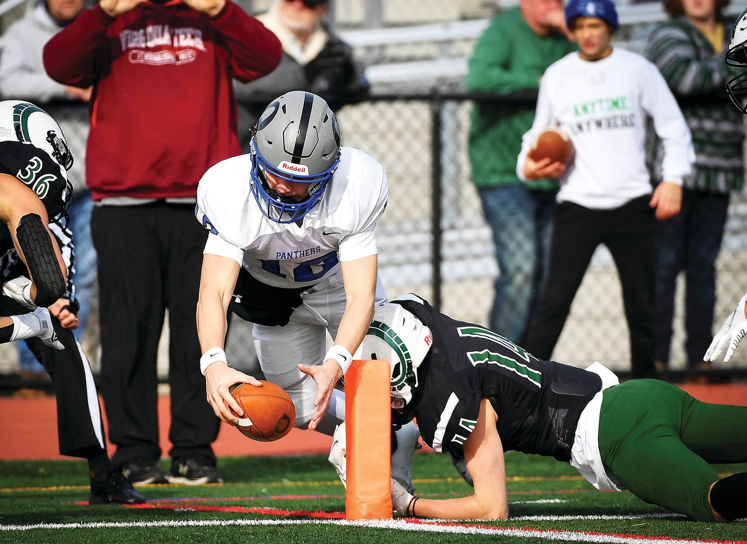 Quakertown’s Will Steich dives just short of the end zone, setting up the first score of the game by Tyler Woodman on a 1-yard run, making it 7-0.