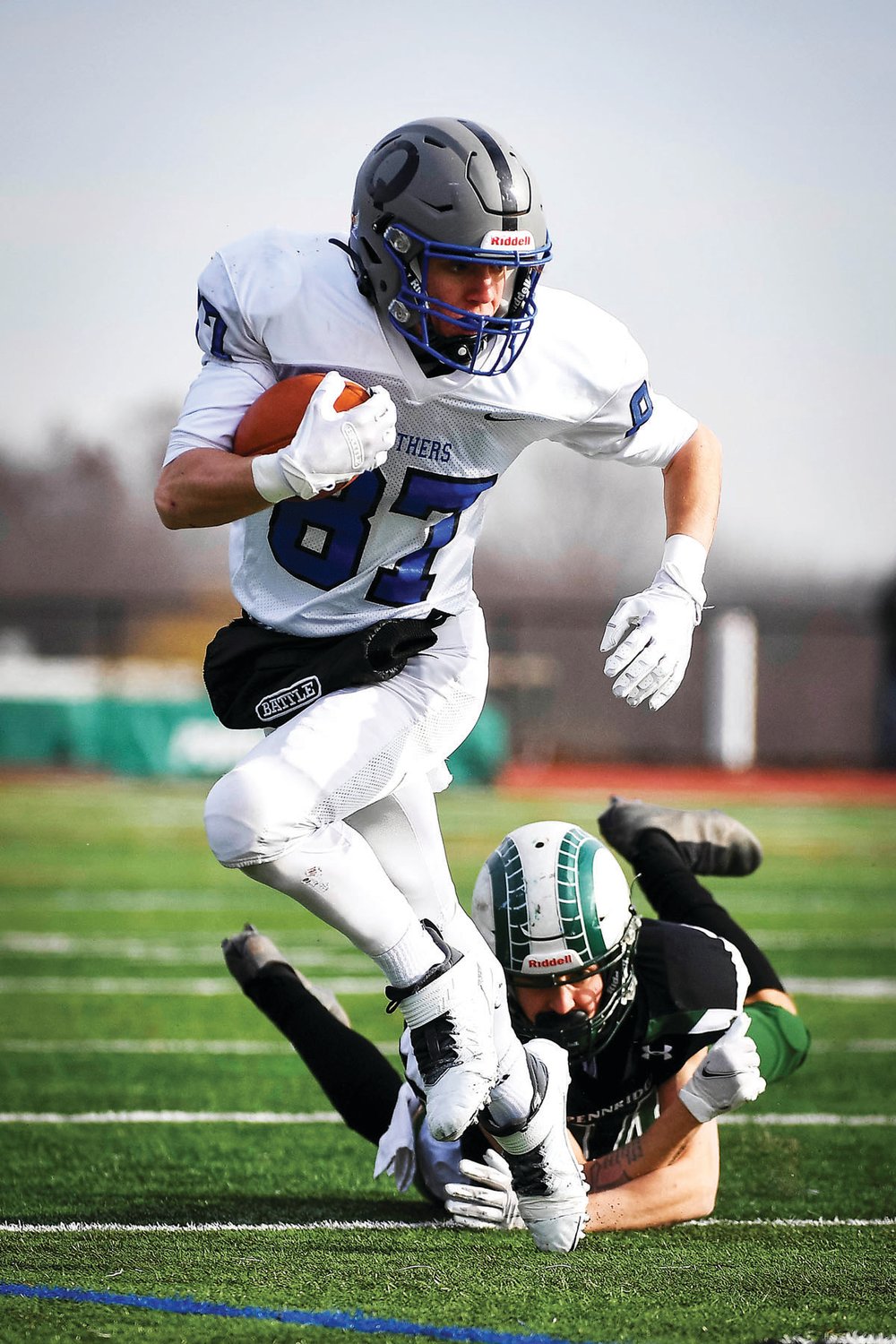 Quakertown’s Zach Fondl breaks a tackle on a pass from Will Steich.