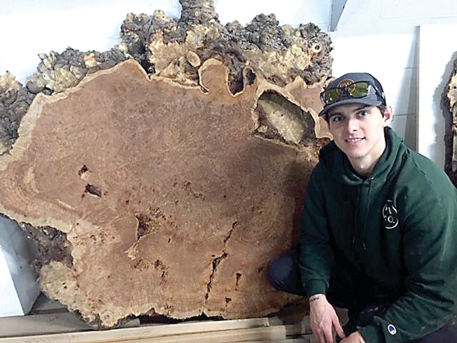 Colin Thompson, founder of Paramount Wood Co., with a slice of burl from a California redwood tree.