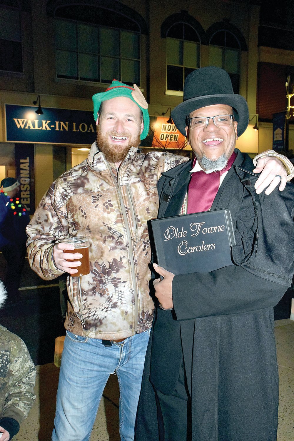 Colin Monahan with Milo Morris of Olde Towne Carolers.