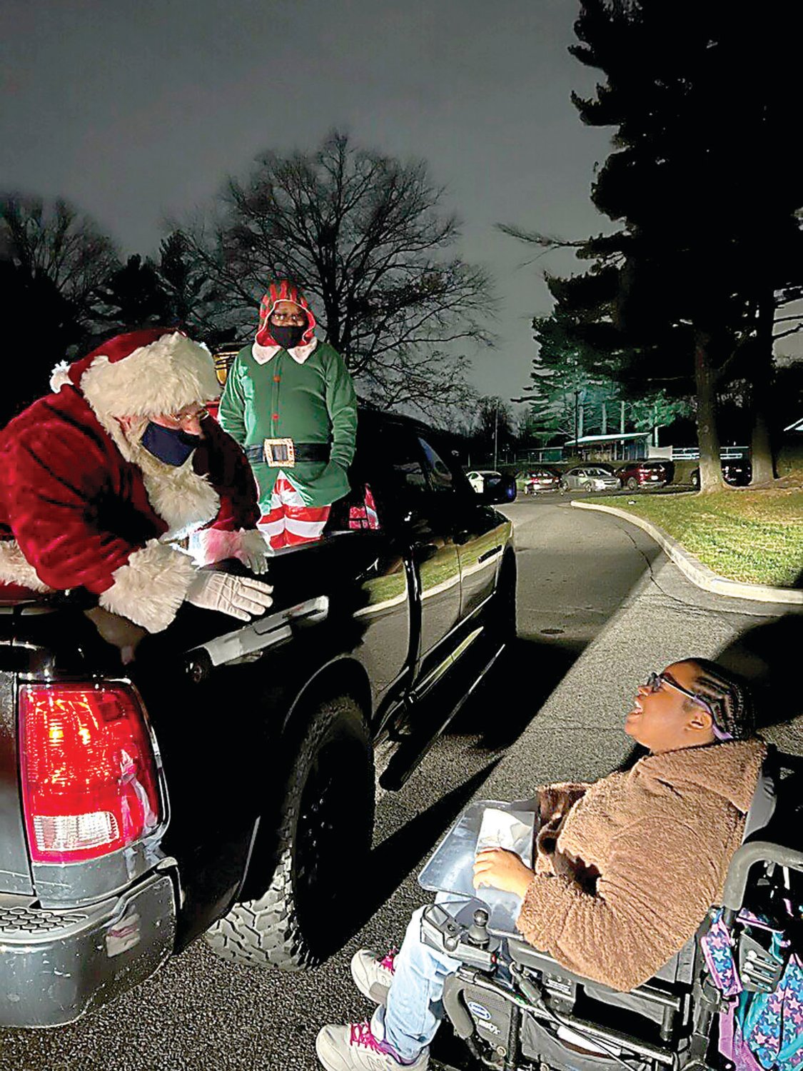 Santa meets a resident of Woods Services.