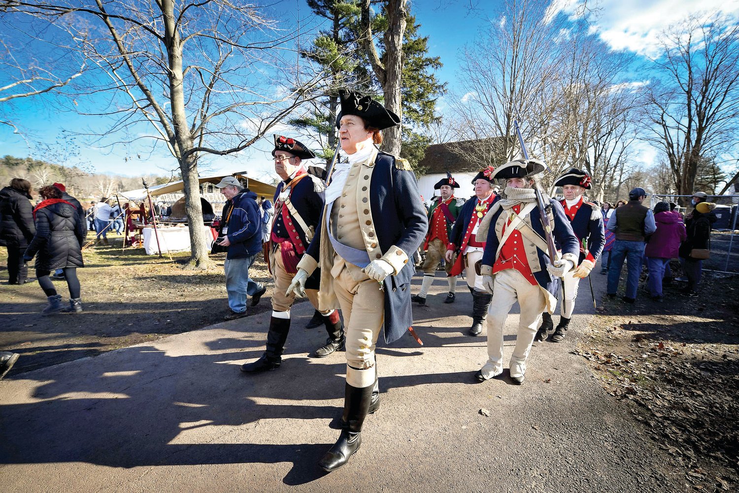 Gen. George Washington, portrayed by John Godziba, and the rest of the officers make their way through the crowd.