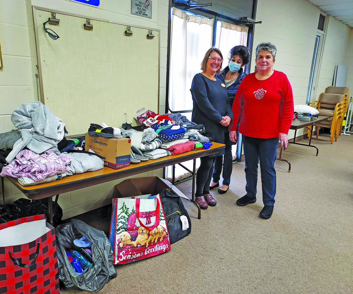 With donated items are, from left, Robin Nissenfeld, HCRAG co-president; Sandra DeSapio, Consignment Shop of Flemington for Victims of Domestic Violence; and Lisa Savino, HCRAG co-president.