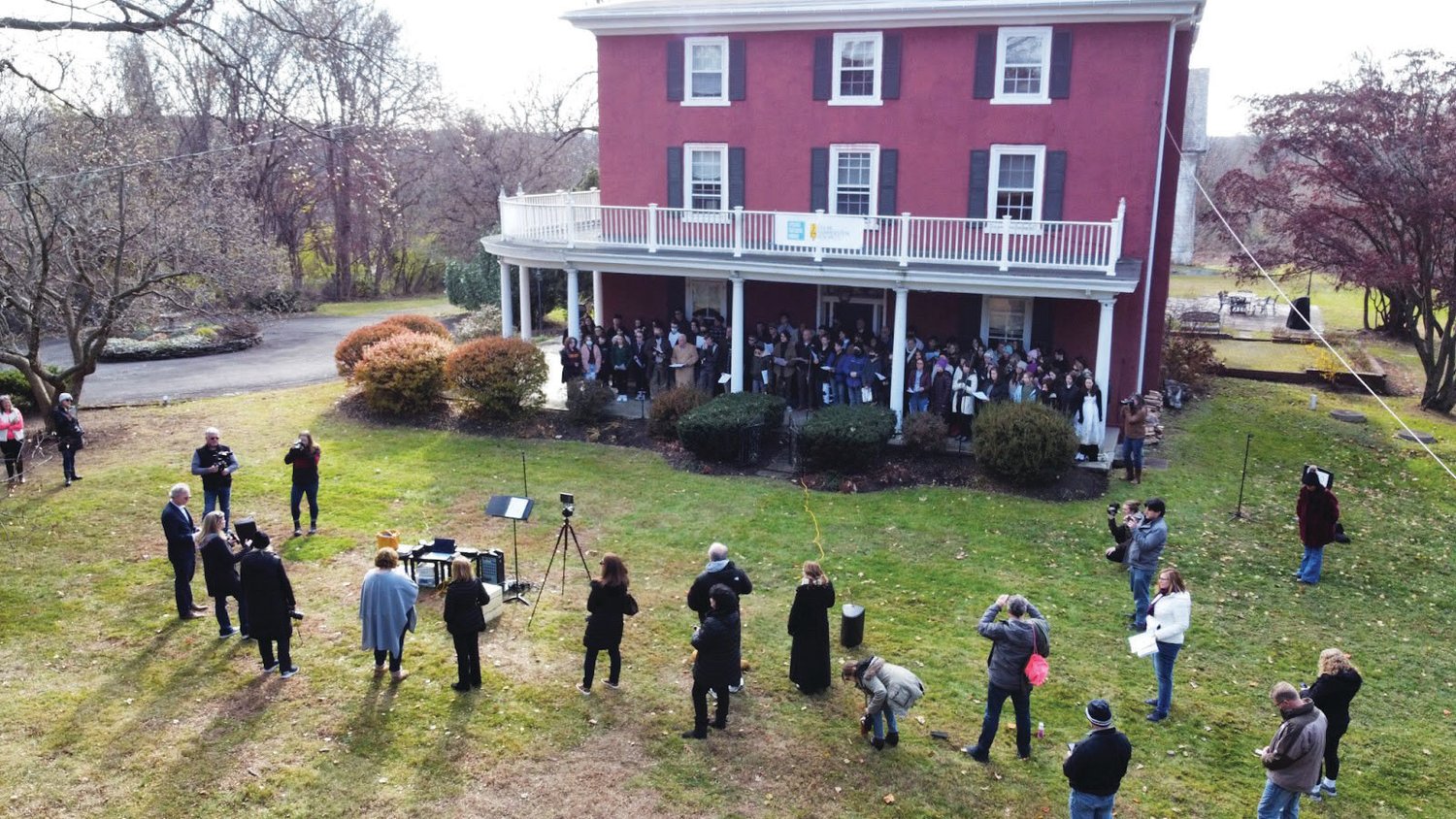 A drone camera caught the scene from above as photographers gathered to photograph singers on the porch at Highland Farm, in Doylestown Township, the former home of Broadway lyricist Oscar Hammerstein II. The event was a tribute to composer and lyricist Stephen Sondheim, a Hammerstein protege, who once lived in the house. Sondheim died Nov. 27 at 91. Highland Farm is now the Oscar Hammerstein Museum.