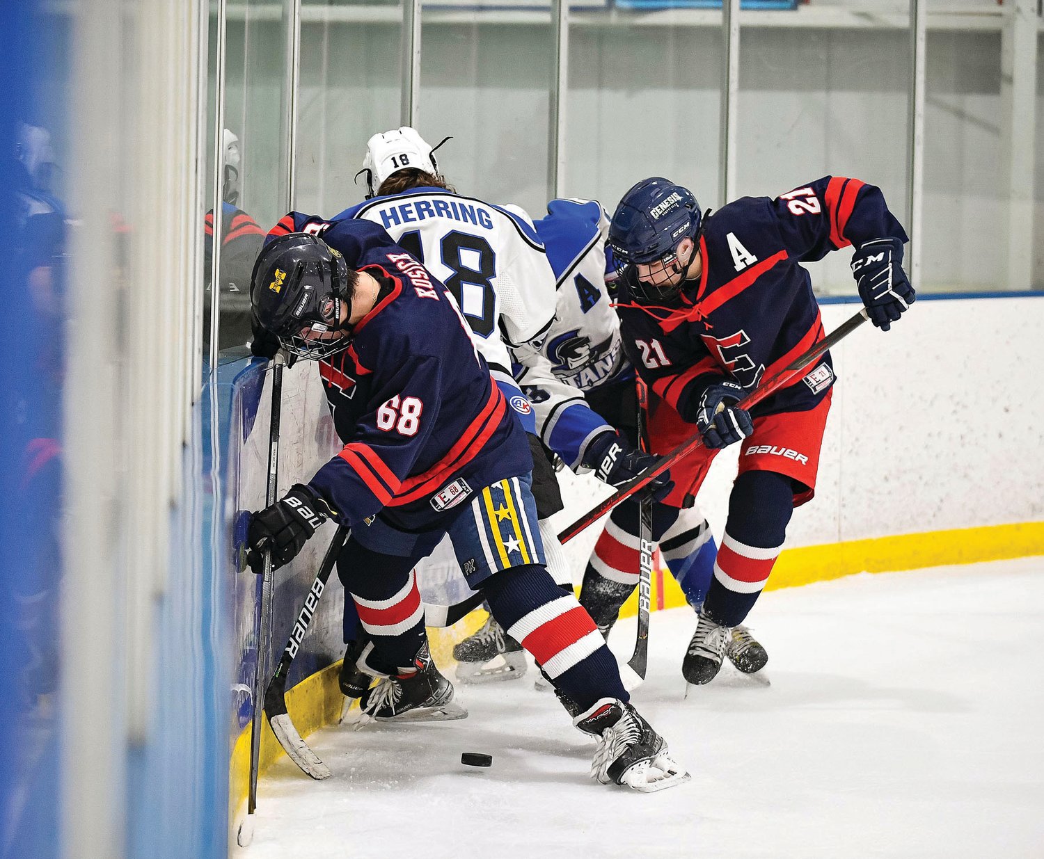 CB East’s Bogdan Borodenko digs the puck out of corner during a scrum in the CB South corner.