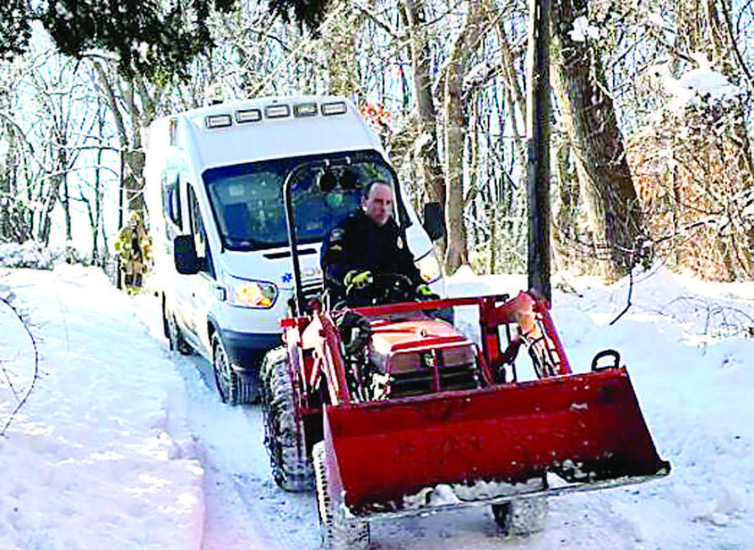 A Solebury police officer rescues an ambulance stuck in the snow during an emergency call. Police officers and a local fire company and a salt truck helped the ambulance reach a patient in need at the end of a long, slippery driveway after a snowy start to the month.
