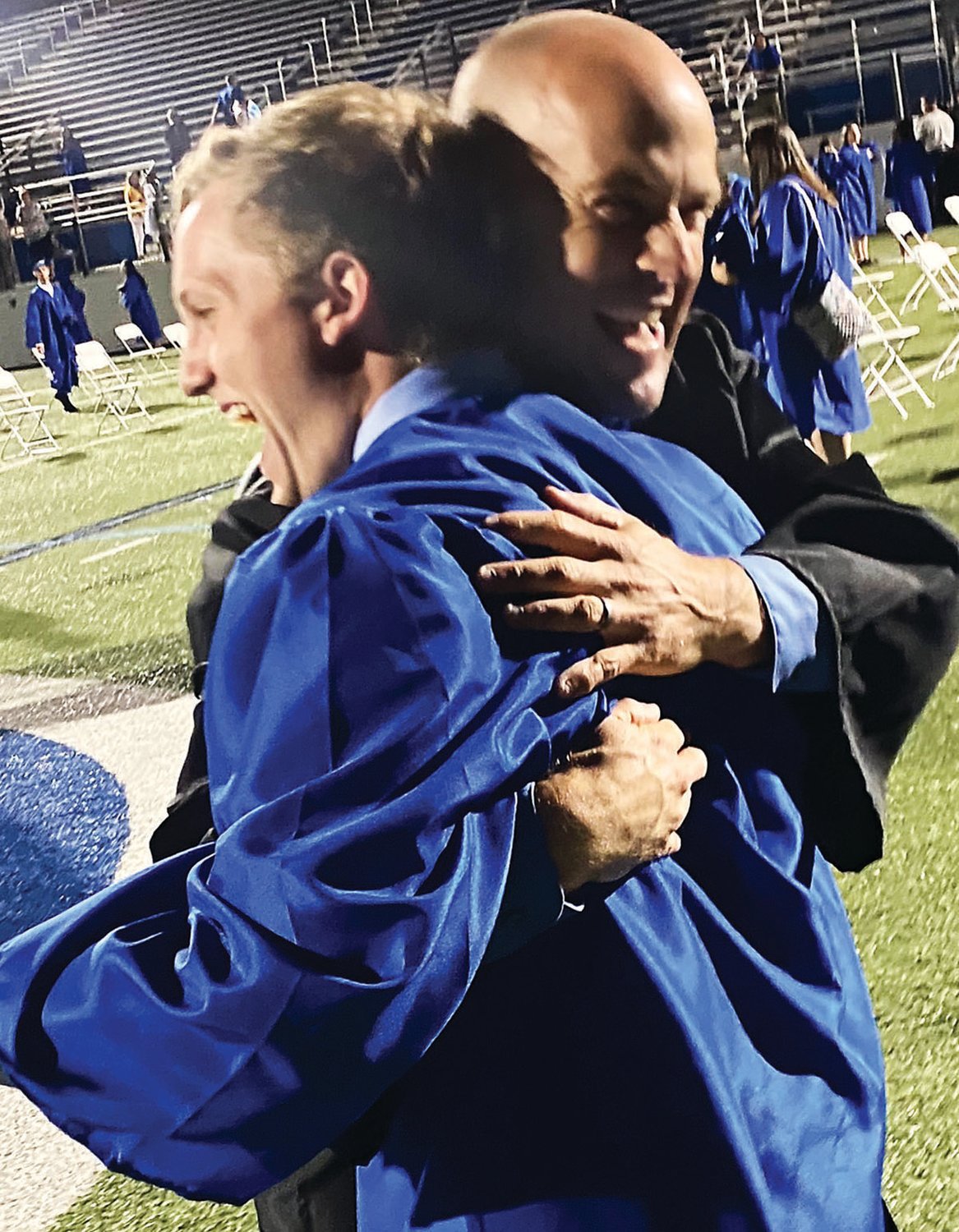 Quakertown Community High School student Mason Smith, left, and teacher Nick Hood celebrate Mason’s graduation June 18. After months of uncertainty, area schools held in-person commencement ceremonies.
