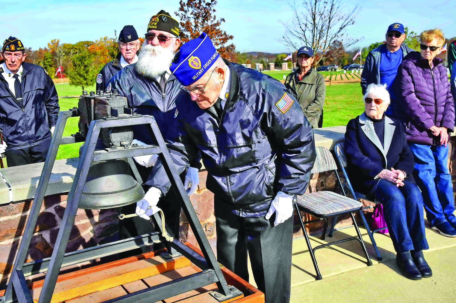 November: At Washington Crossing National Cemetery’s Veterans Day Ceremony, World War II veteran Salvador Castro, 96, rings the bell commemorating all who gave up their lives fighting for this country in all wars.