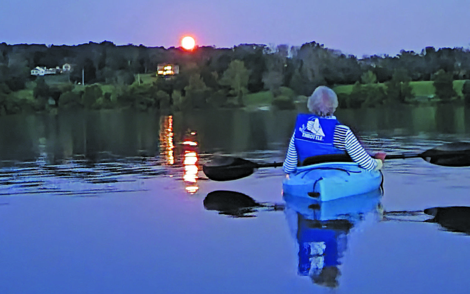 August: Marie Progin watches from her kayak as the late summer sun sets over Lake Galena in Peace Valley Park.