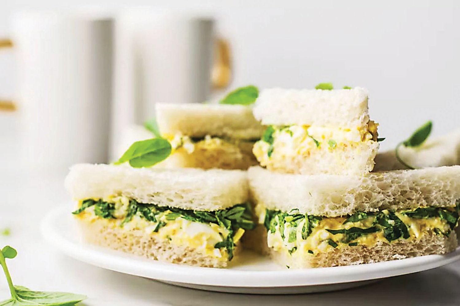 Tiny sandwiches are a must when preparing a formal tea. These are egg with watercress but you can make anything you like when you create your own tea.