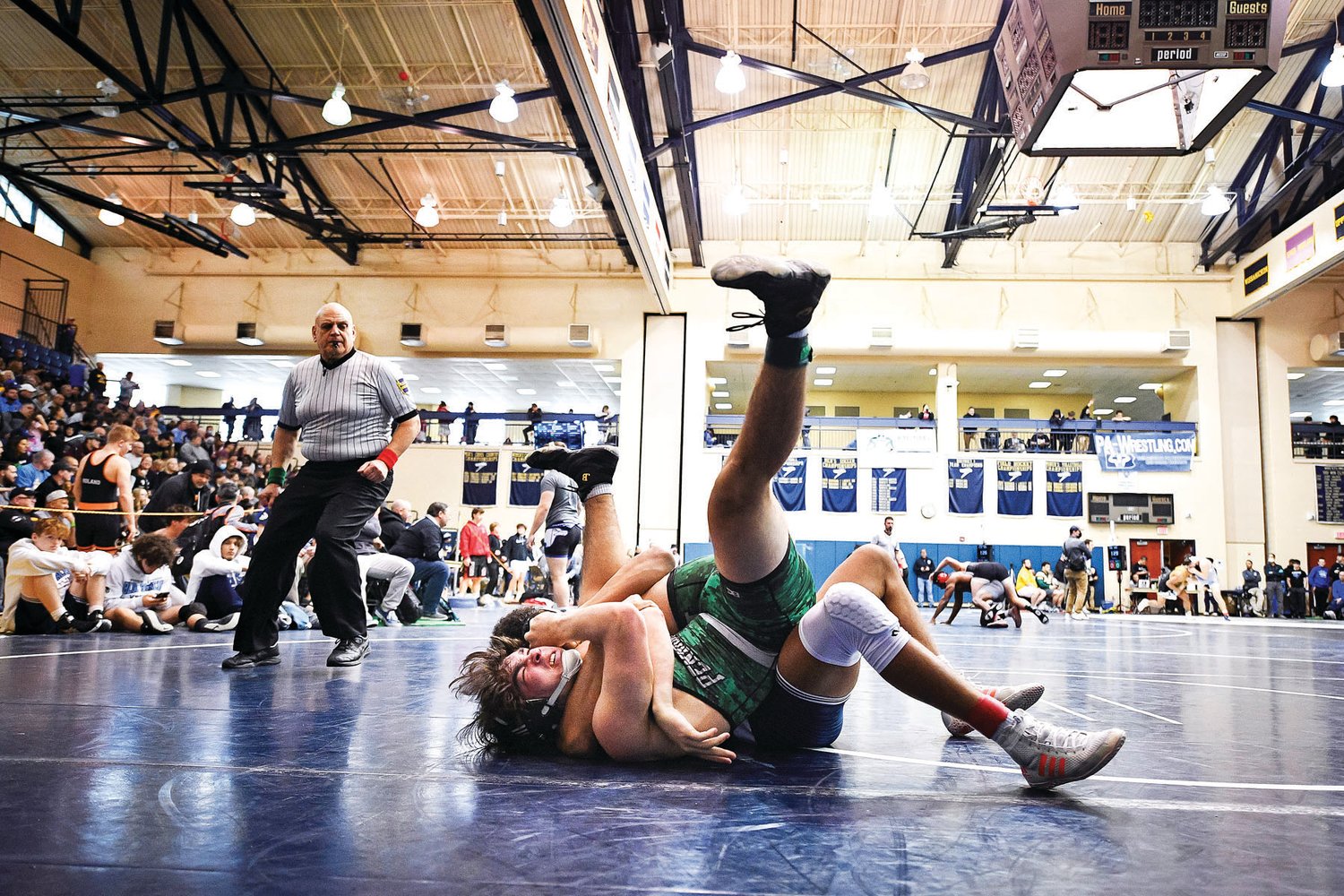 Pennridge’s Ryan Gallagher struggles to get loose during his 15-0 loss to Manheim Township’s Kevin Olavarria.