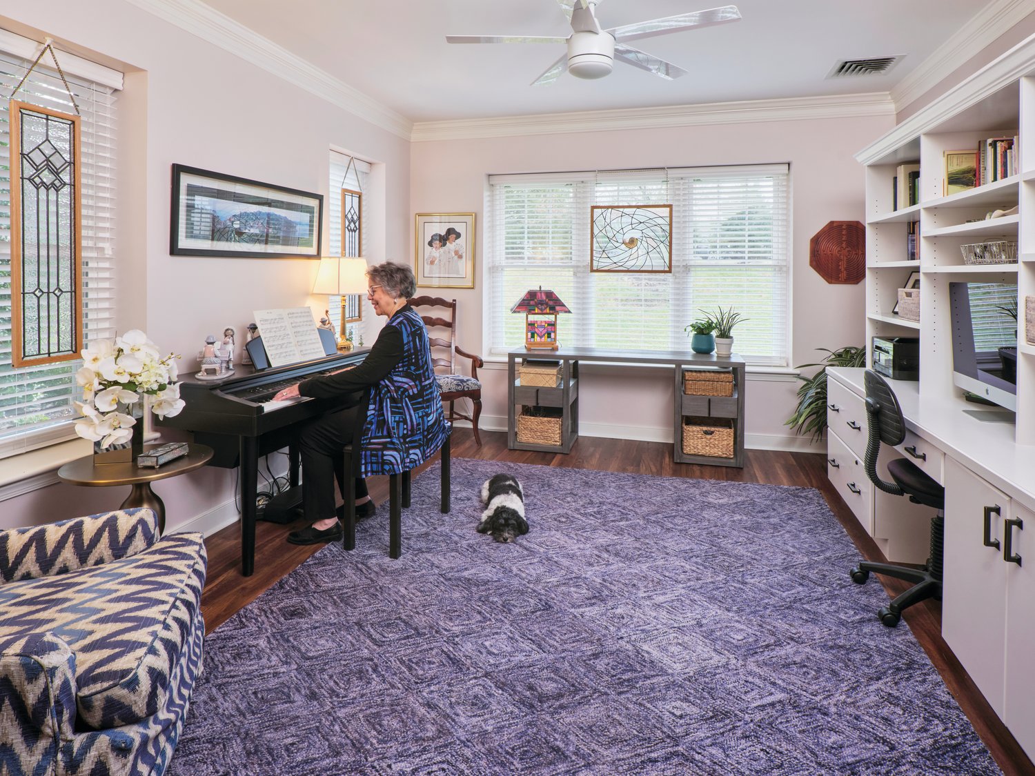 Inez enjoys playing piano in the light-filled room off the living room. It is also where she has her office.
