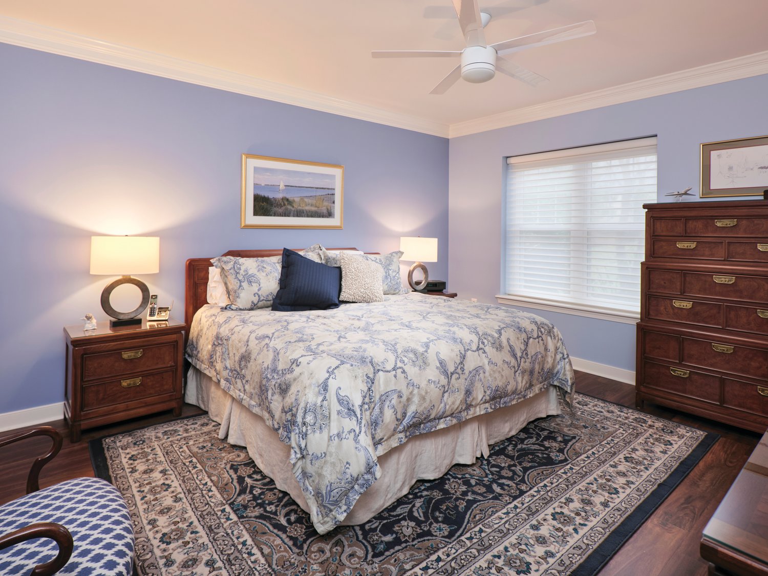 The blue and gray colors throughout the apartment are continued in the master bedroom.