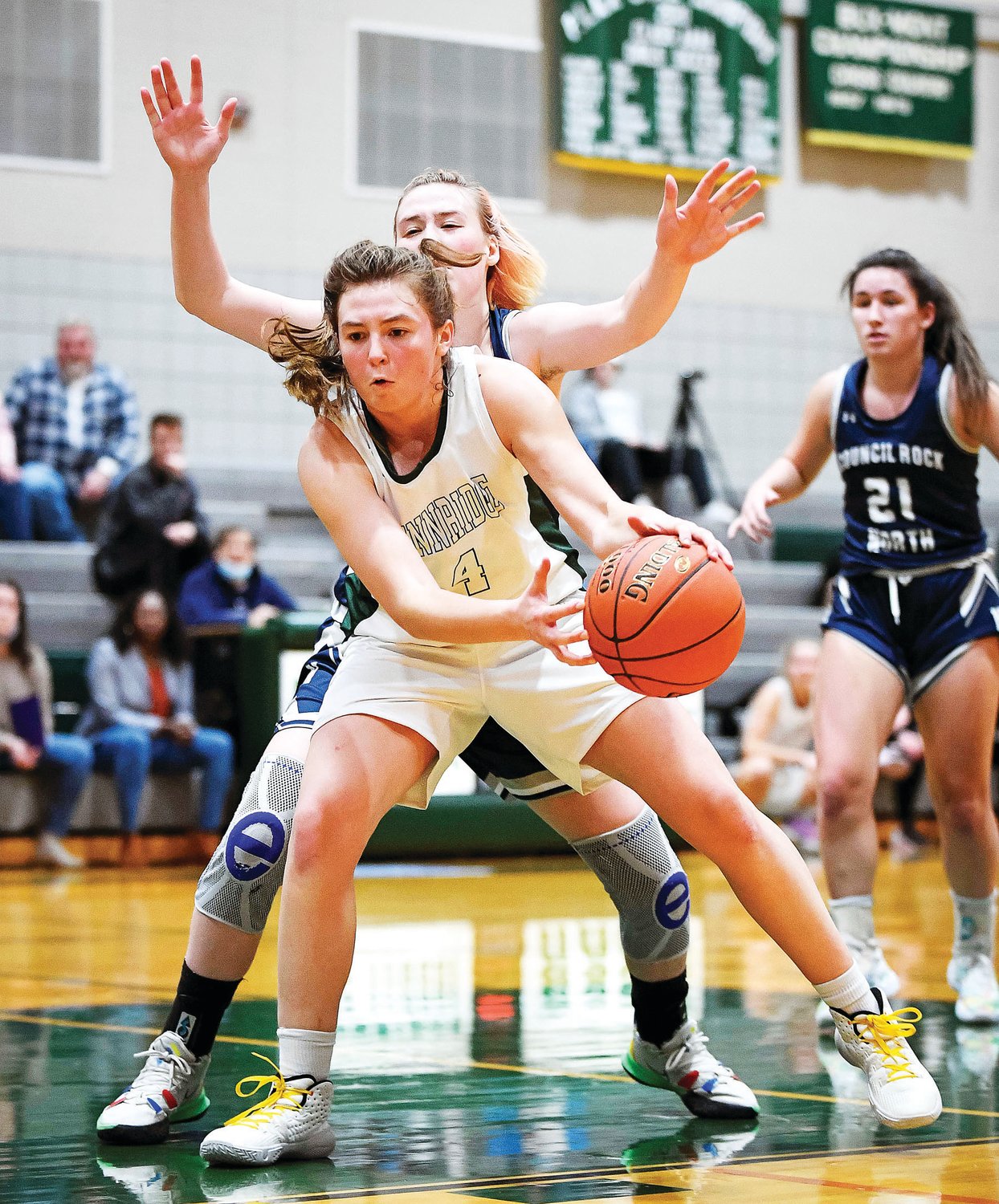 Pennridge’s Katie Yoder, the game’s high scorer, gets a pass down in the paint in front of CR North’s Ruth O’Keeffe.