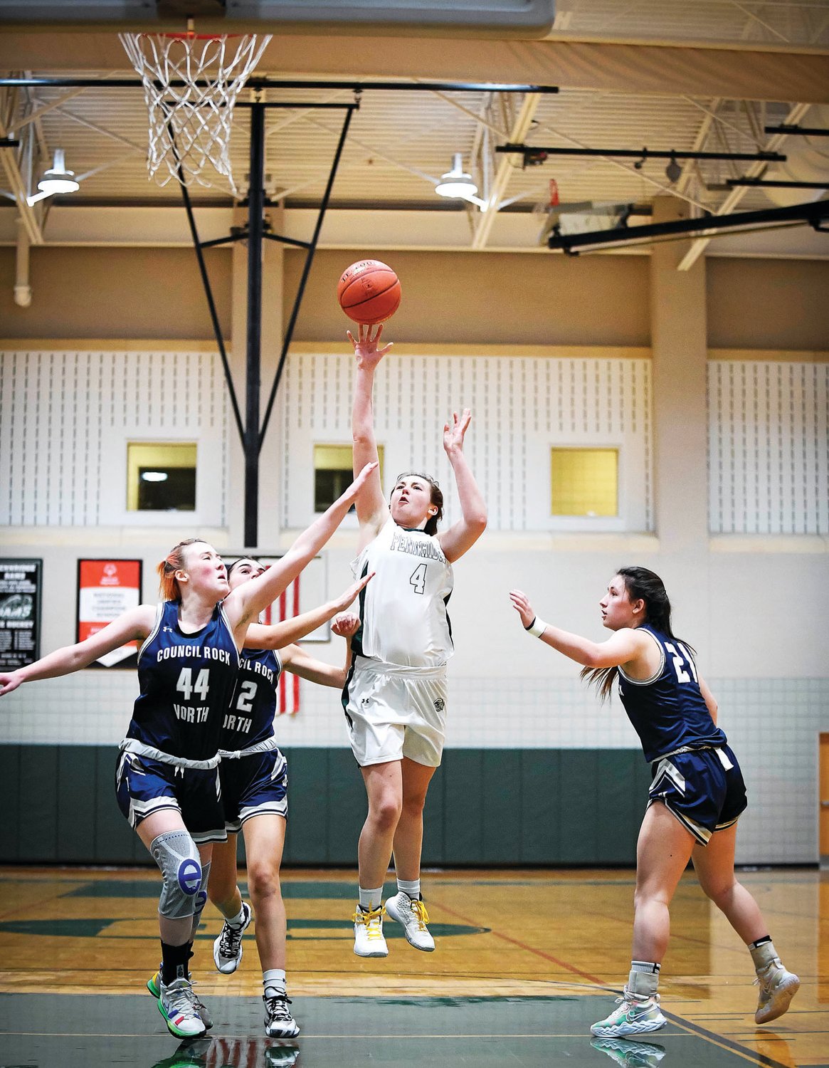 Pennridge’s Katie Yoder splits the CR North defense for two of her game-high 20 points.