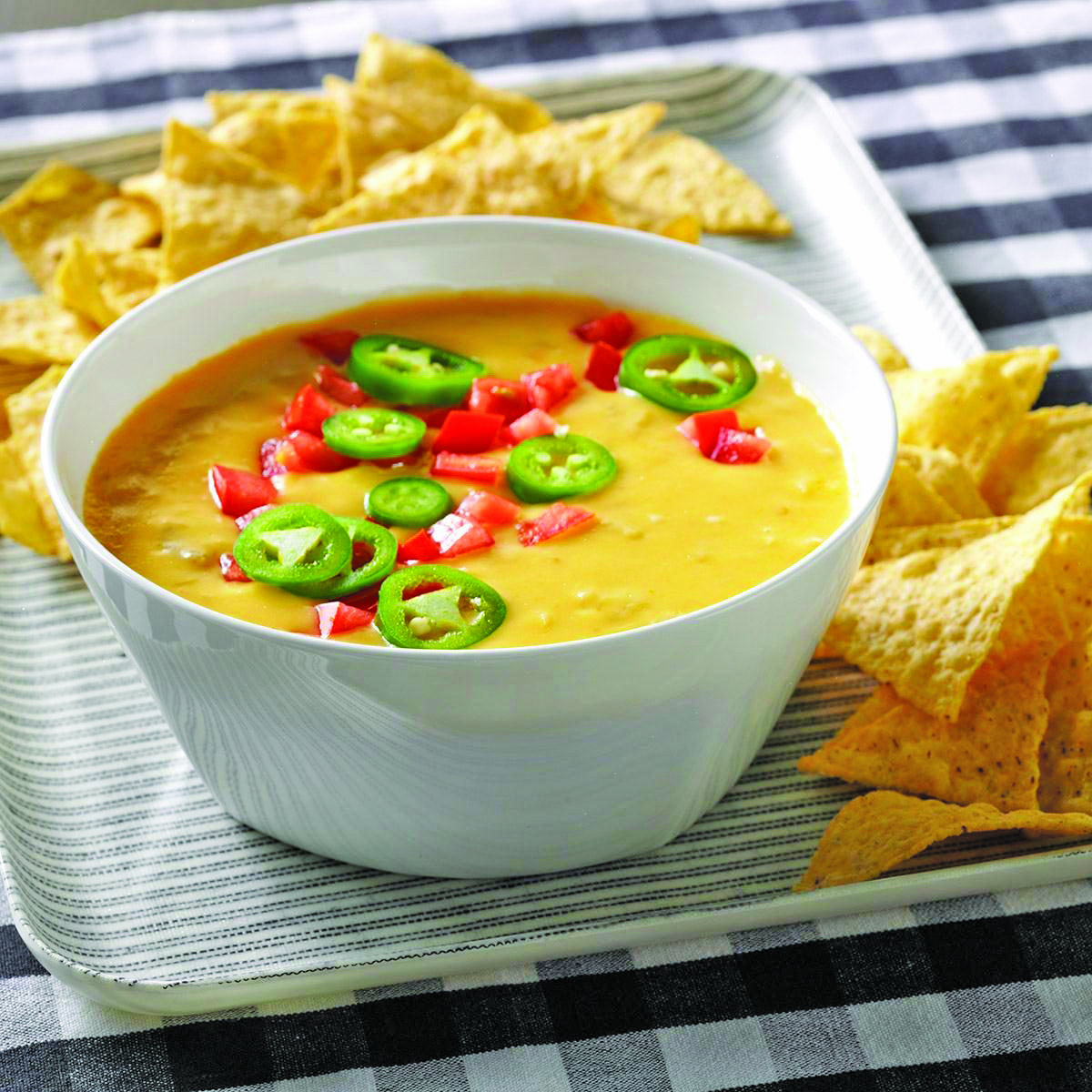 You can make this easy queso recipe spicy or mild for the Super Bowl or any other party.