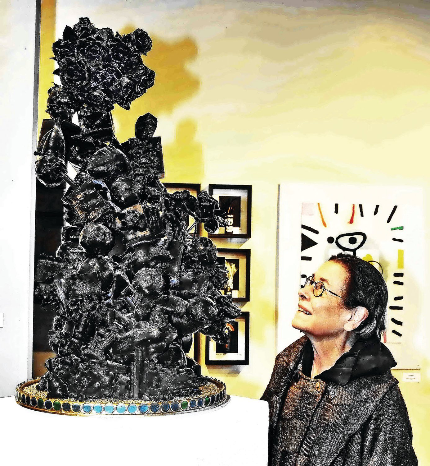 Anna Maria Ciccone with a sculpture by Guy Ciarcia, titled “Black,” in mixed media.
