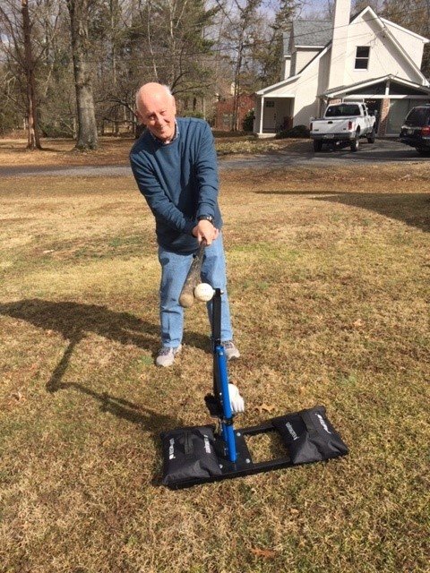 Chris Cunnane of Tinicum Township takes a swing at the baseball-hitting device he invented.  He holds two patents on Max T.