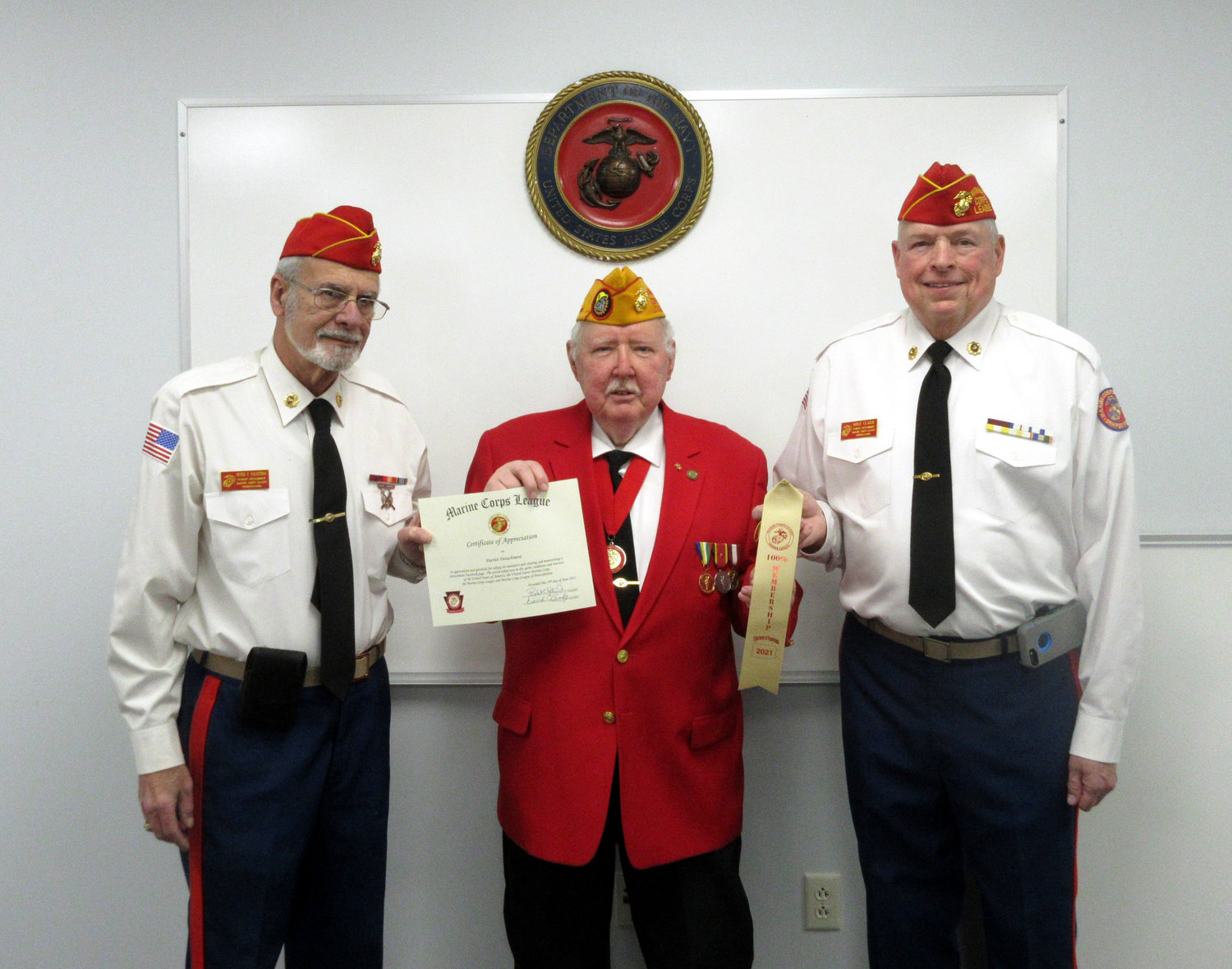 District 2 Vice Commandant Gene Irvin presents 2021 Detachment Facebook Recognition Award to Pete Palestina, left, and the 100% Membership Award Ribbon to Commandant Mike Clark, right.