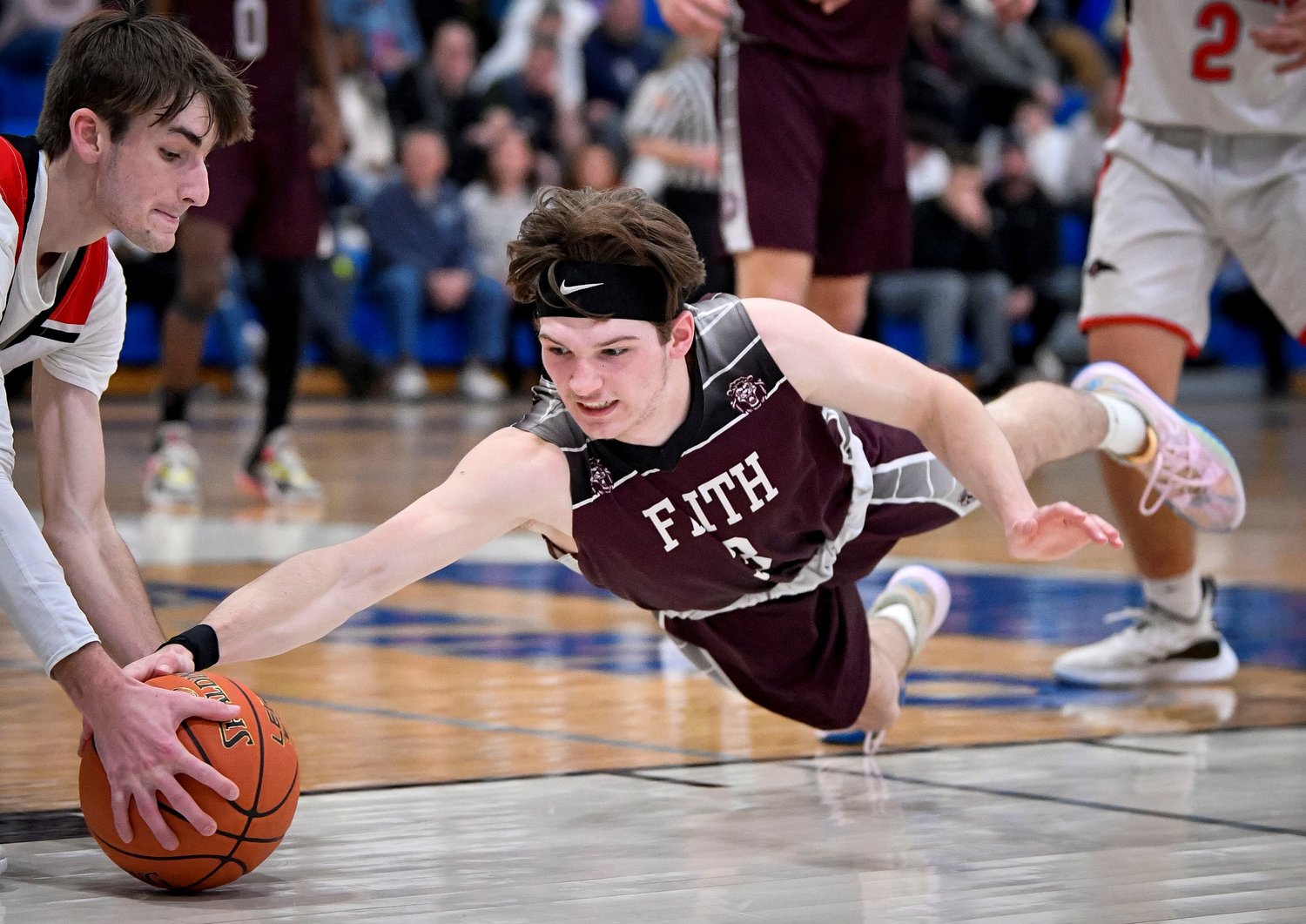 Faith’s Shane O’Connor dives for a loose ball in front of Plumstead’s Nicholas Phillipps.