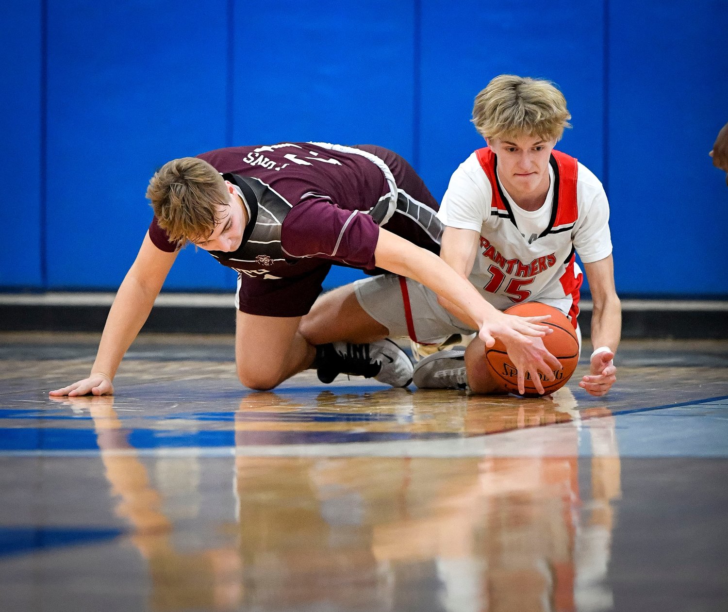 Plumstead’s Zach Knudsen gathers a loose ball in front of a diving Bryce Robison.
